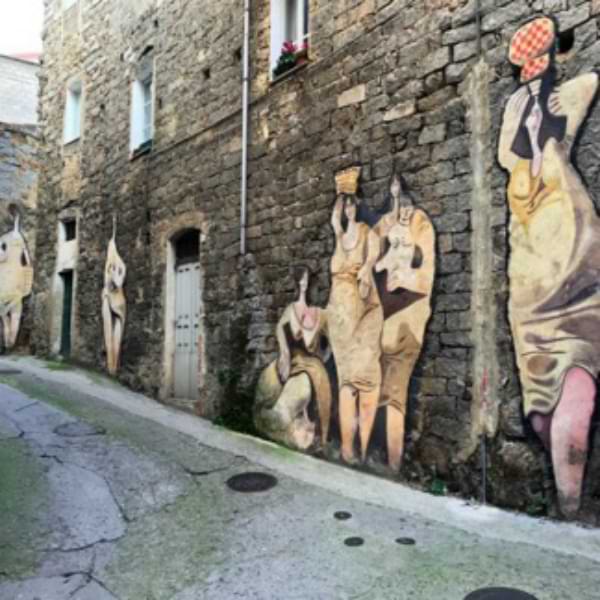 Mural painted on a wall depicting local women.