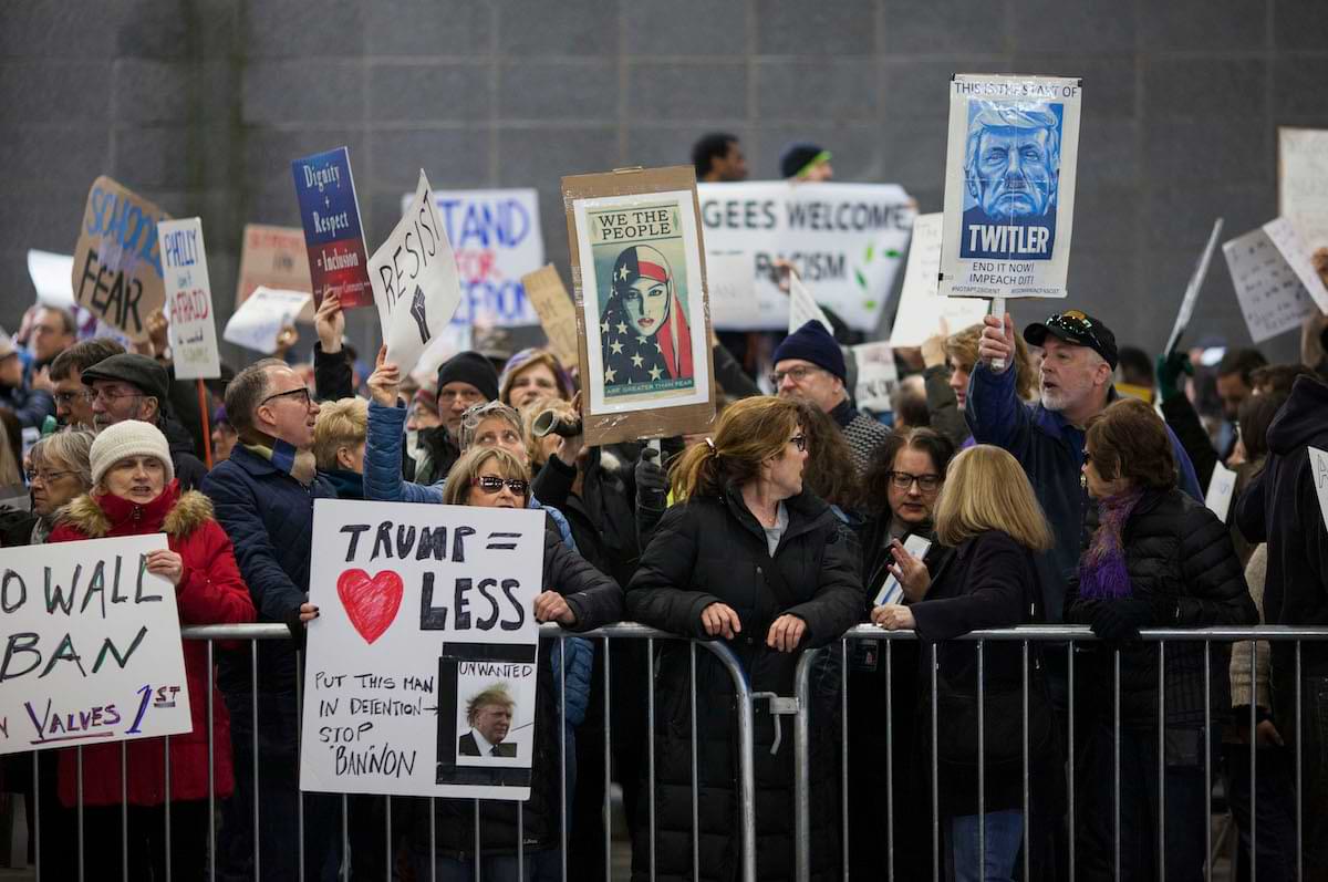 Twitler titled Trumpicon Poster Participating in a January 2017 Philadelphia International Airport Protest against President Donald Trumps Executive Order Banning
          Muslim Immigration.