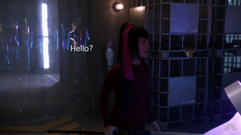 Alone in a room, Miko is looking around. Open subtitles that say “Hello?” appear to her left.