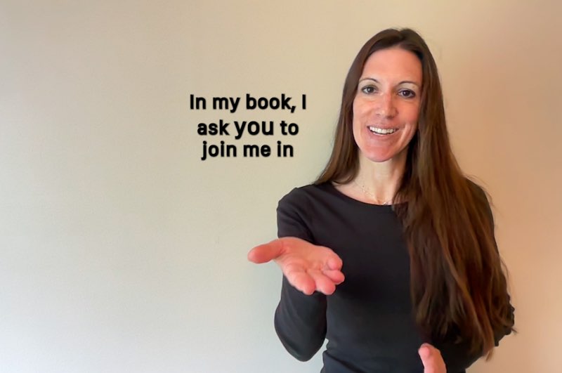 Janine Butler faces the camera while signing "you." Subtitles appear next to her that read, "I ask you to join me in." The word "you" is larger than the other words.