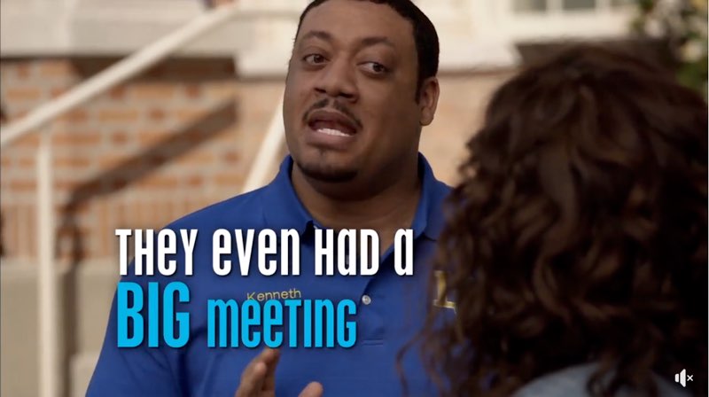 Kenneth is speaking to JJ's mother. Capitalized open captions state, "They even had a big meeting." The word “BIG” is larger than the other words. The first four words are white while the last two words are blue.