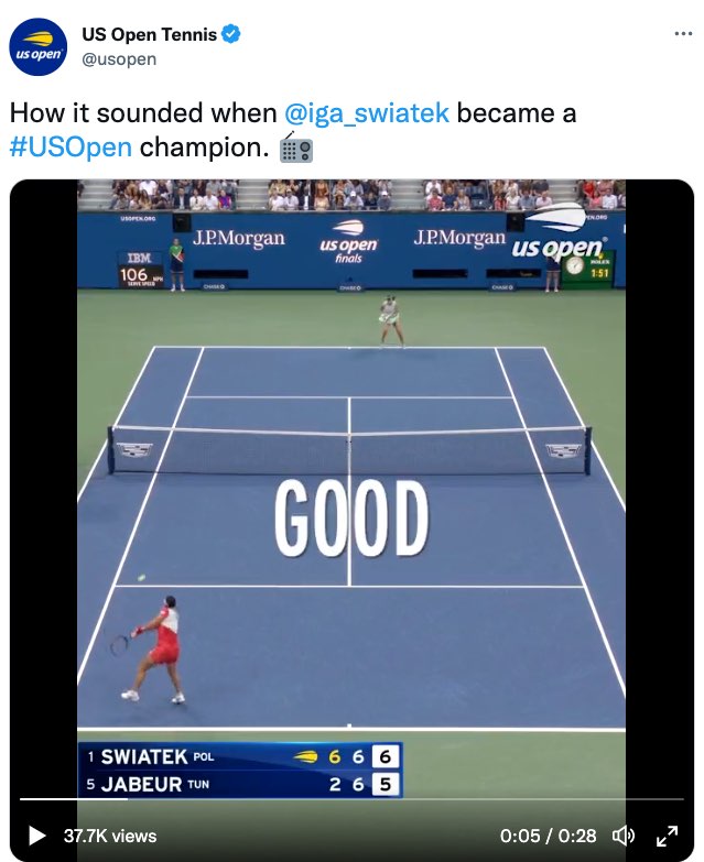 A screenshot shows a tweet by US Open Tennis that reads, "How it sounded when @iga_swiatek became a #US Open champion." The tweet ends with a radio emoji, and includes a video of Swiatek and Jabeur playing on a tennis court in the third set with Swiatek leading 6-5. The large open captions over the middle of the court on the video show, "good."